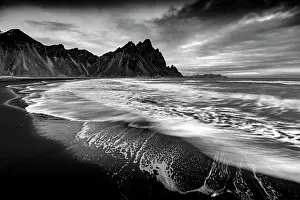 Icelandic Prints: Vestrahorn mountain in winter, with waves washing up the black sand beach