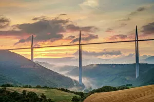 Images Dated 5th July 2014: Viaduc de Millau bridge over Tarn river valley at sunrise, Millau, Aveyron Department