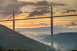Viaduc de Millau bridge over Tarn river valley at sunrise, Millau, Aveyron Department
