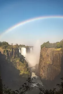Images Dated 12th October 2017: Victoria Falls, Zimbabwe, Africa. Rainbow and water steam