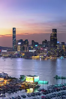 Tsim Sha Tsui Prints: Victoria Harbour and Tsim Sha Tsui skyline at sunset, Hong Kong, China