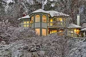 Images Dated 23rd March 2022: Victorian style lighted house framed in a snowy landscape, Bremerton, Washington, USA