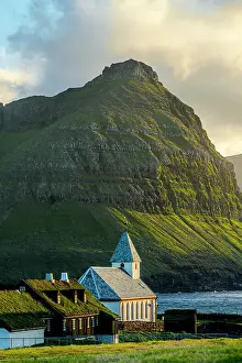 Vidareidi Prints: Vidareidi church and grass roof houses framed by majestic mountains of Bordoy island