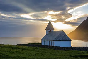 Vidareidi village, Vidoy island, Faroe Islands, Denmark. Villages church at sunset