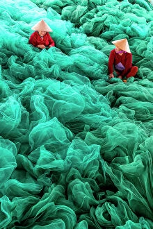 Craft Gallery: Vietnam, Cam Ranh, women mend green fishing nets
