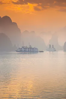Vietnam, Halong Bay, tourist boats, sunrise