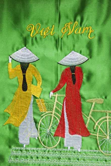Images Dated 30th March 2011: Vietnam, Hanoi, Needlework on Souvenir Handbag depicting Women in Traditional Ao-dai