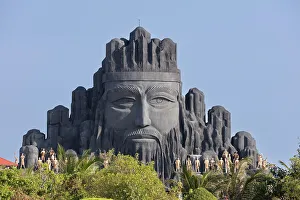Head Prints: Vietnam, Mekong Delta, Bac Lieu, a giant sculpture of a head in Nha Mat amusement park