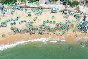 Round Gallery: Vietnam, Phu Yen Province, Song Cau, an aerial view of basket boats on the beach