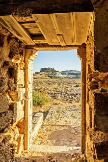 Acropolis Of Lindos Gallery: A view of the Acropolis of Lindos through an old windmill, Lindos, Rhodes, Dodecanese Islands
