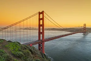 View from Battery Spencer over the Golden Gate suspension bridge with city skyline View from Battery Spencer over the Golden Gate suspension bridge with city skyline