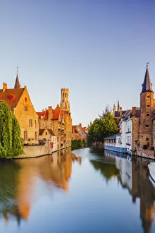 Images Dated 25th November 2019: View of Bruges old town reflecting in the water canal at sunrise, Belgium
