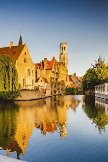 Flemish Region Prints: View of Bruges old town reflecting in the water canal at sunrise, Belgium