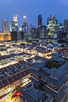 View over Buddha Tooth Relic Temple & city skyline at dusk, Chinatown, Singapore