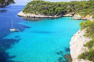 View of Cala Macarelleta and sailboat, Menorca; Balearic Islands; Spain; Europe