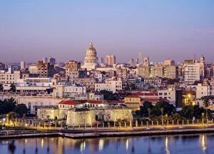 Colonial Gallery: View over Castle of the Royal Force and Habana Vieja towards El Capitolio at dawn, Havana