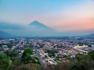 Nightfall Prints: View from Cerro de La Cruz towards the city and Agua Volcano at dusk