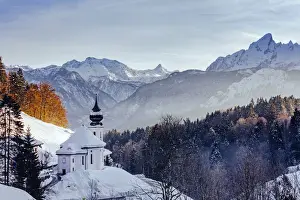 View of the church of Wallfahrtskirche Maria Gerna at sunset in winter sorrounded