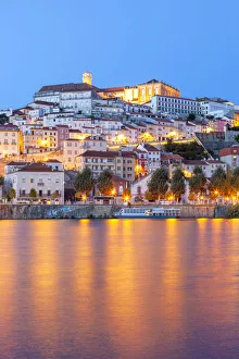 Centro Region Prints: View of Coimbra ol town and Mondego River at dusk. Coimbra, Coimbra district