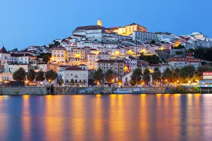 View of Coimbra ol town and Mondego River at dusk. Coimbra, Coimbra district