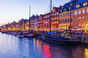 Images Dated 25th November 2019: View of colored houses reflecting in Nyhavn water canal by night in Copenhagen, Denmark