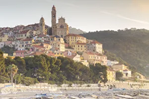 View of the colorful town and beach of Cervo at sunrise