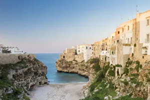Adriatic Sea Gallery: View of the cove Lama Monachile Cala Porto of Polignano a Mare at sunset. Bari district