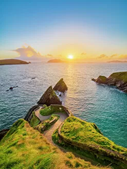 Images Dated 31st March 2023: View over Dunquin Pier towards Blasket Islands at sunset, Dingle Peninsula, County Kerry, Ireland