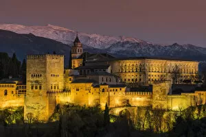 Images Dated 5th April 2016: View at dusk of Alhambra palace with the snowy Sierra Nevada in the background, Granada