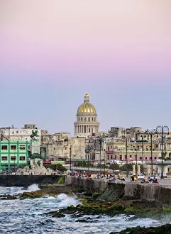 Colonial Gallery: View over El Malecon and Centro Habana towards El Capitolio at dusk, Havana