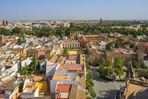 Alcazar Prints: View from the Giralda tower of the Cathedral on the Real Alcazar and Sevilla, UNESCO