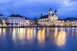 Bell Towers Prints: View of the Jesuit Church and the old town of Lucerne at blue hour reflected on the Reuss