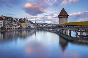 Monuments Prints: View of the Kapellbrucke bridge and the Wasserturm at sunset reflected on the Reuss river