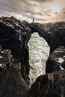 Basalt Prints: View of a man standing on the Stone Bridge