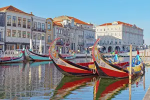 Multicoloured Prints: View of moliceiro boats floating on Aveiro river main lagoon, Aveiro, Portugal