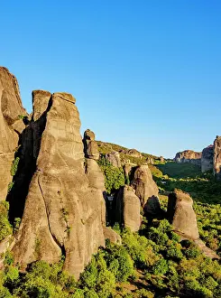 View towards Monasteries of Saint Nicholas Anapafsas and Rousanou at sunset, Meteora, Thessaly, Greece