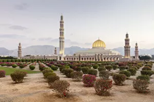 Islamic Architecture Collection: A view of the mosque and gardens illuminated in the evening, Sultan Qaboos grand mosque