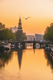 Amsterdam Gallery: View of the NEMO science museum by Renzo Piano and Montelbaanstoren in Amsterdam