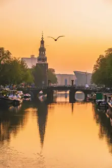 Urban Landscape Prints: View of the NEMO science museum by Renzo Piano and Montelbaanstoren in Amsterdam
