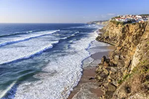 Top view of ocean waves crashing on the high cliffs of Azenhas do Mar Sintra Portugal