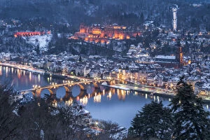 View of the old town of Heidelberg seen from the Philosophers Way in winter at night