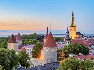 View over the Old Town towards St Olafs Church at dusk, Tallinn, Estonia