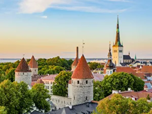 Tallinn Prints: View over the Old Town towards St Olafs Church at sunset, Tallinn, Estonia