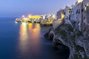 Bari District Prints: View of the overhanging houses and caves of Polignano a Mare at night. Bari district