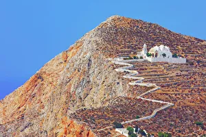 Folegandros Prints: View of Panagia Kimissis church built on a cliff above the sea