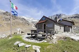 Camonica Valley Prints: View of Rifugio Tonolini framed by the high peaks Val Malga Adamello Regional Park