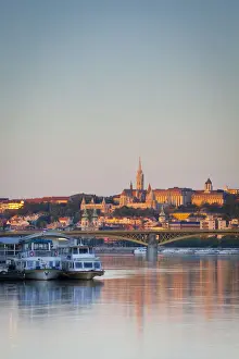 View along the River Danube towards Buda Hill & the Martyas Church illuminated