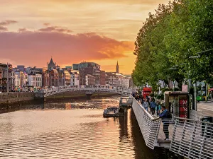 Bank Prints: View over River Liffey towards Ha'penny Bridge at sunset, Dublin, Ireland