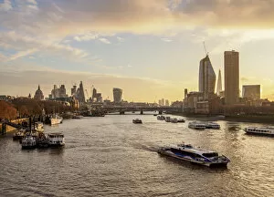 View over River Thames towards Southwark and City of London at sunrise, London, England