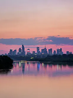 View over River Vistula towards City Centre Skyline at dusk, Warsaw, Masovian Voivodeship, Poland